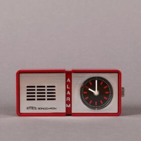 close up shot of a red alarm clock