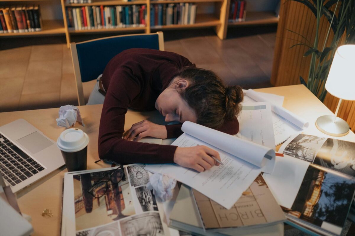 tired woman sleeping on desk